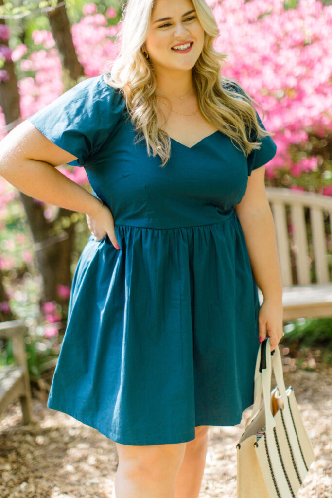 Close-up of the Angela dress in Teal on a blonde plus-size woman.